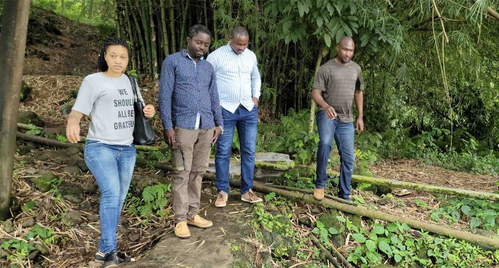LARREN researchers walking a forest trail